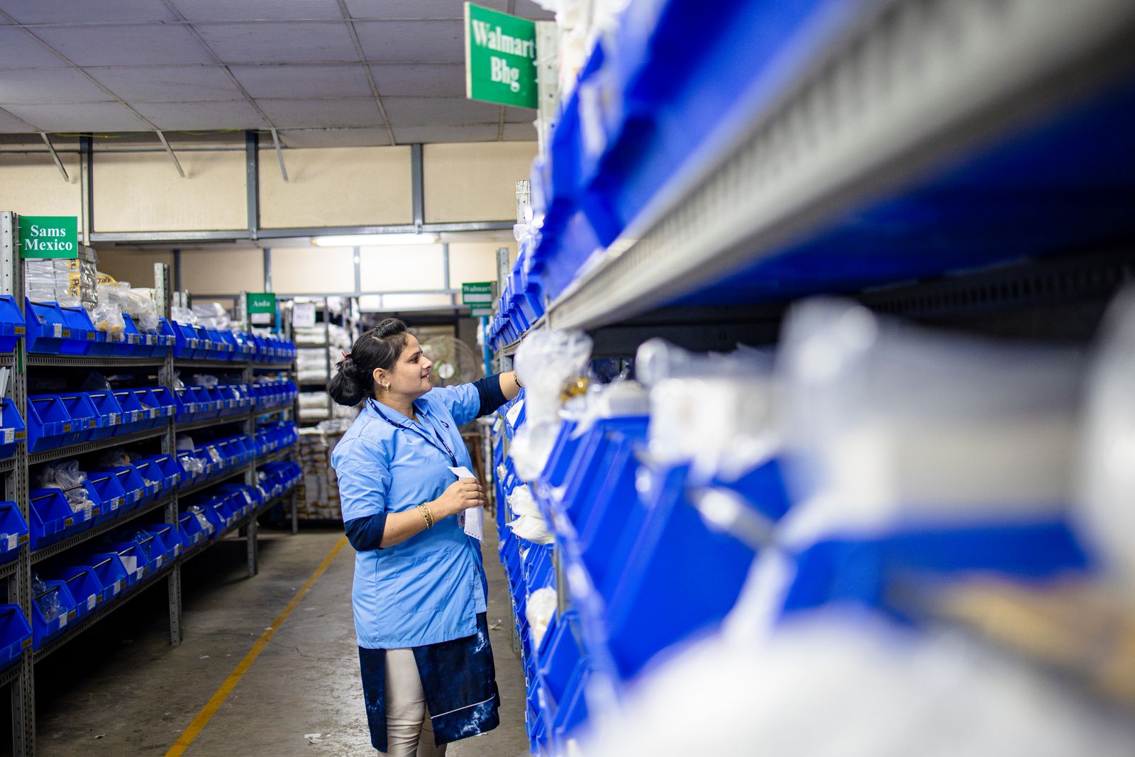 Deepa Traders staff handling an off-the-road tyre.