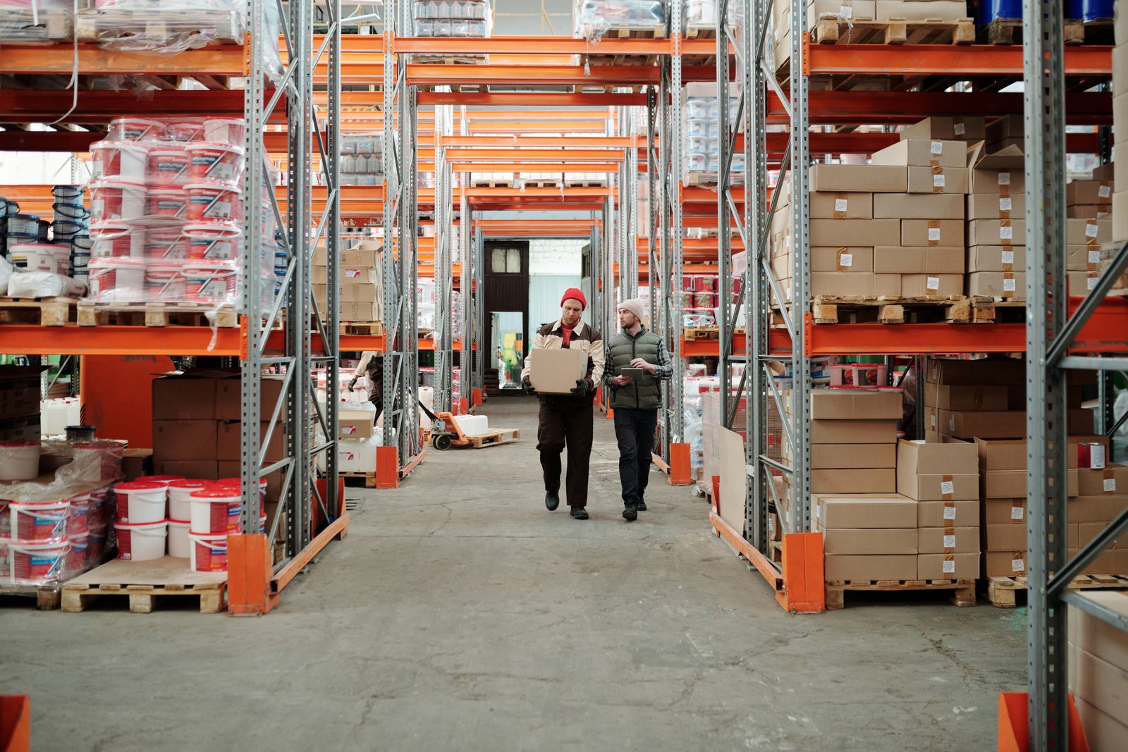 Deepa Traders staff checking a part number against a customer requirement.